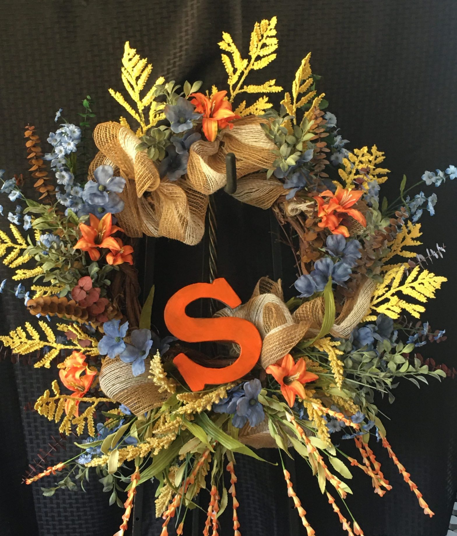 wreath with a Capital S on it